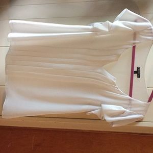 White pleated blouse